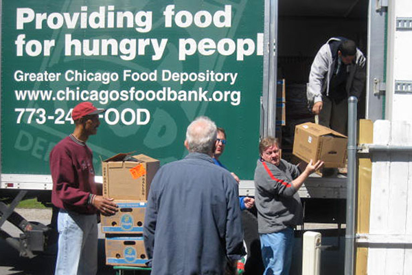 TWC volunteers unload a truck for the Greater Chicago Food Depository.